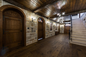 Basement foyer area with wooden doors in luxury mansion - obrazy, fototapety, plakaty