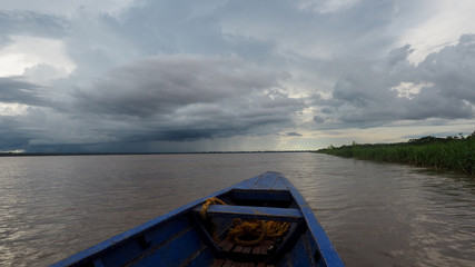 stormy and cloudy weather at the amazonas in peru. view from a boat