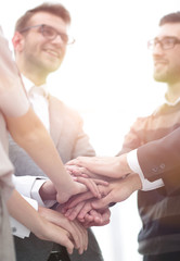 Fototapeta premium business colleagues with their hands stacked together