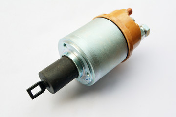 Tractor starter relay on isolated white background. New spare part.