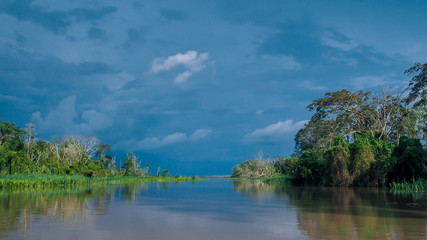 Fototapeta na wymiar A storm is coming. View from a boat in the amazonas river in peru