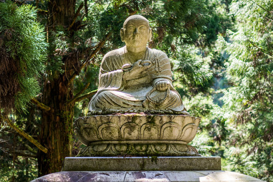 Buddhist sculpture depicting departed monk in the Okunoin cemetery in Koyasan Mount Koya, UNESCO world heritage site and a 1200 years old center of Japanese sect of of Shingon Buddhism