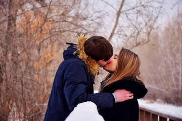 A loving couple gently kisses