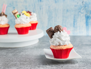 Tasty cupcakes on wooden table,