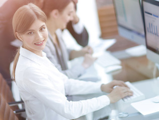 young employee sitting at a Desk