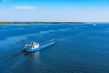 Cargo ship sailing on the sea or river
