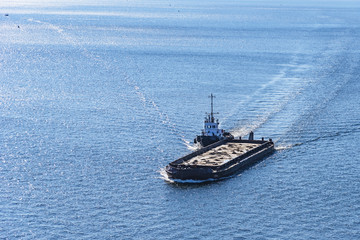 Tug and sand barge