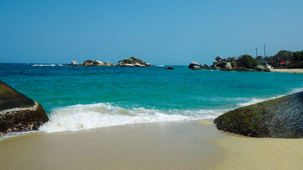 tropical beach with turquoise water at tayrona natural park