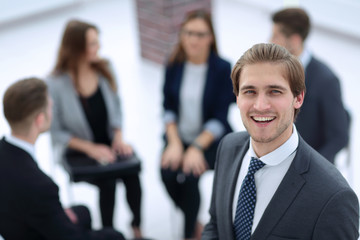 Businessman looking at the camera with a smile.