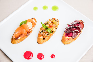 Mini sandwiches food set. Brushetta or authentic traditional spanish tapas for lunch table. Delicious snack, appetizer, antipasti on party or picnic time. Top view.