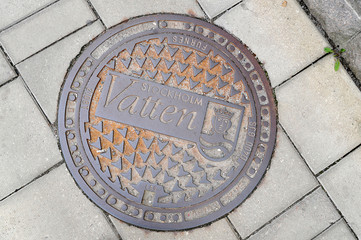 a manhole on the street of the old town in Stockholm