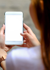 Smart phone white display in hand girl.