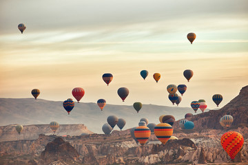 Mountain landscape with large balloons in a short summer season at dawn.