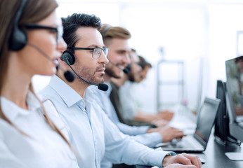 close up.background image of call center employees in the workplace