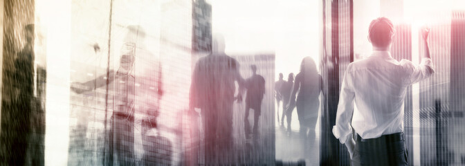 The double exposure image of the business man with cityscape image.