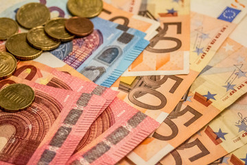 A composition of euro banknotes and coins providing great options to be used for illustrating subjects as business, banking, media, presentations etc.