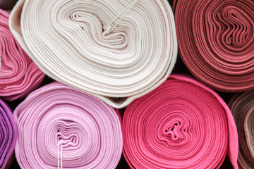 Fototapeta na wymiar Colorful fabric rolls, circle pattern