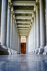 Corridor with tall columns in the Basilica of San Paolo. Rome. Italy.
