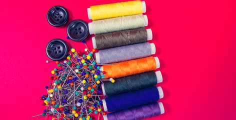 Supplies and accessories for sewing - threads, pins, buttons, centimeter.