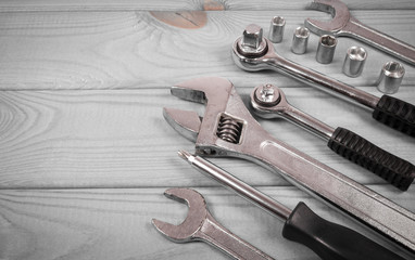 Top view of working tools on wooden background. Construction concept.