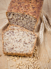 Multi-grain bread on a wooden background. Healthy food concept.