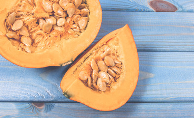 Pumpkins on rustic blue background. Autumn background.