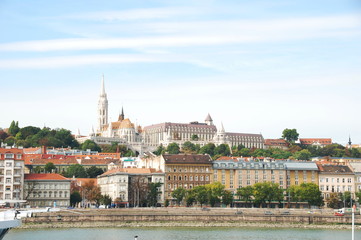 View of Matthias church and Fisheman`s bastion from Danube bank in Budapest, Hungary