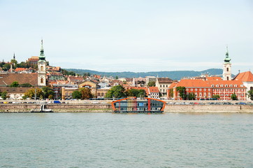 Danube embankment in Budapest with colorful historical buildings around, Hungary