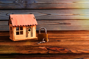 house, castle, keys on the background of a wooden table. housing, real estate, housing market, property insurance.