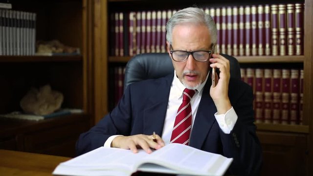 Lawyer talking on the phone in his studio