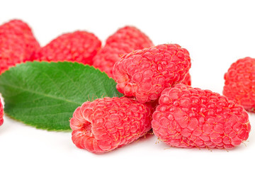 ripe juicy raspberries on white table