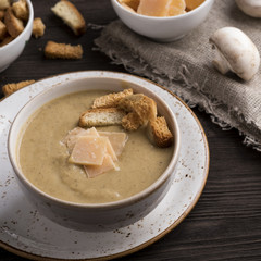 Obraz na płótnie Canvas Mushroom soup with toasts and cheese