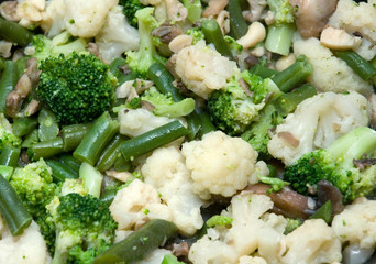 Meal made of cooked green beans, cauliflower, broccoli and mushrooms. Opened composition - some of them coming out of the scene