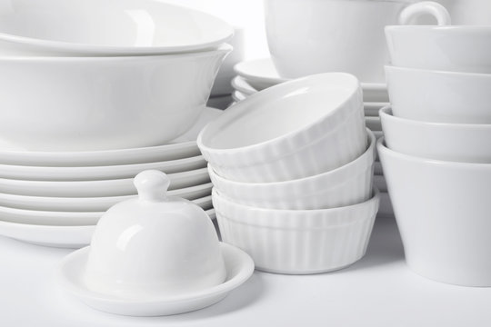 Set Of Clean Tableware On White Background, Closeup. Washing Dishes