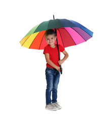 Little boy with rainbow umbrella on white background