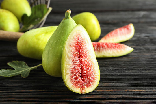 Fresh ripe figs on wooden table. Tropical fruit