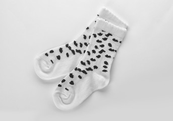 Cute child socks on white background, top view