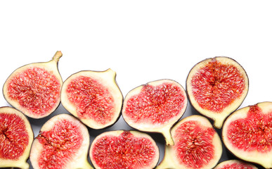 Cut ripe figs on white background, top view