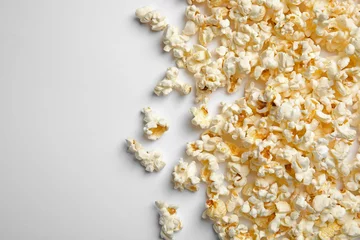 Rolgordijnen Delicious fresh popcorn on white background, top view © New Africa