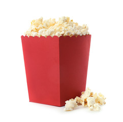 Red bucket with delicious popcorn on white background