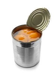 Tin can with conserved peach halves on white background