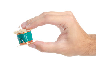 Electrical transformer power in hand on white background isolation