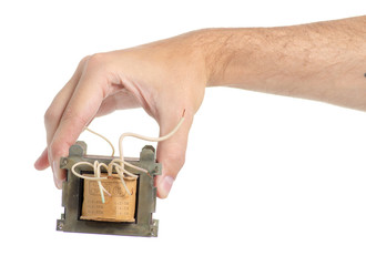 Obraz premium Electrical transformer power in hand on white background isolation