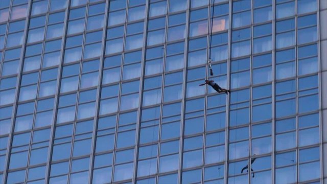 Man Jumping from Skyscraper. Base Flying In City. Extreme Sports.
