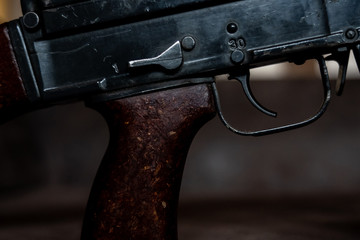 Low key photo of AK-47 Kalashnikov rifle. Dark themed automatic rifle from Russia/Soviet union.