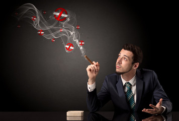 Businessman smoking with colored no smoking symbols nearby.