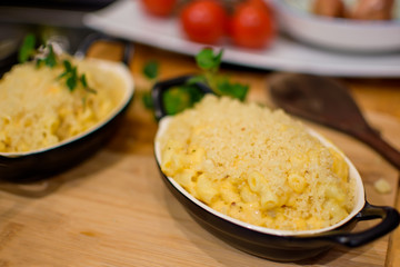 Macaroni and Cheese in cozy kitchen autumn and fall comfort foods cooking background