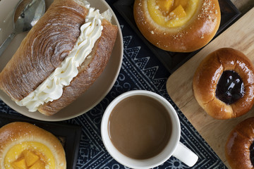 Bakery set of various breads, Cream bread, Blueberry liberty bun, Mini peach crumble and coffee.