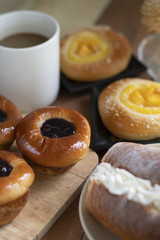 Bakery set of various breads, Cream bread, Blueberry liberty bun, Mini peach crumble and coffee.