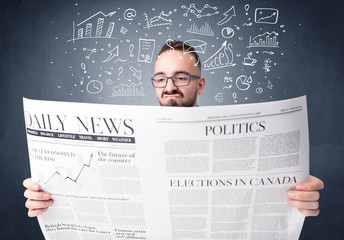 Young smart businessman reading daily newspaper with business plan graphics above his head